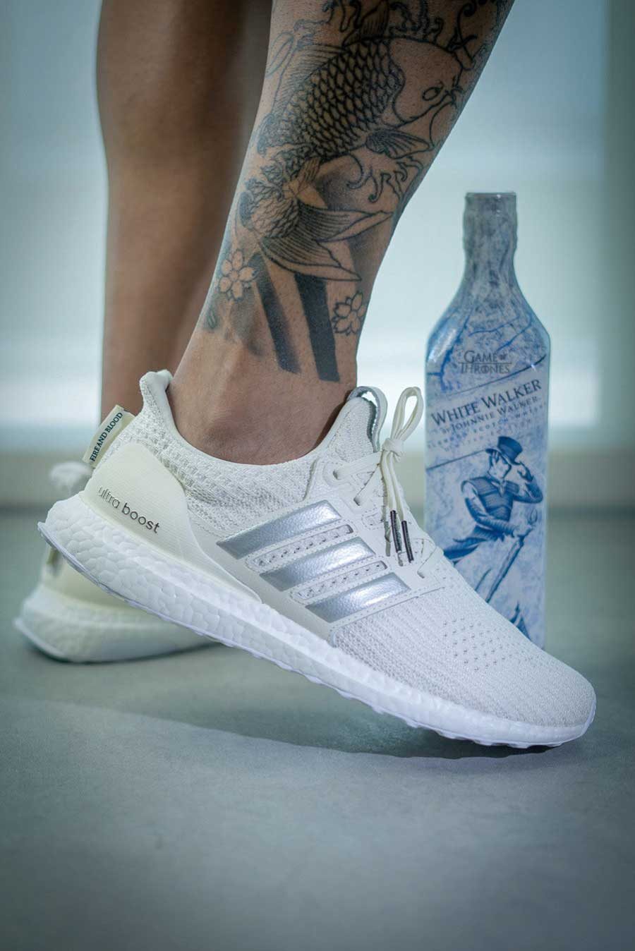 first-images-of-the-rumored-white-and-grey-e28098fire-and-bloode28099-adidas-sneakers-revealed-4-3608582