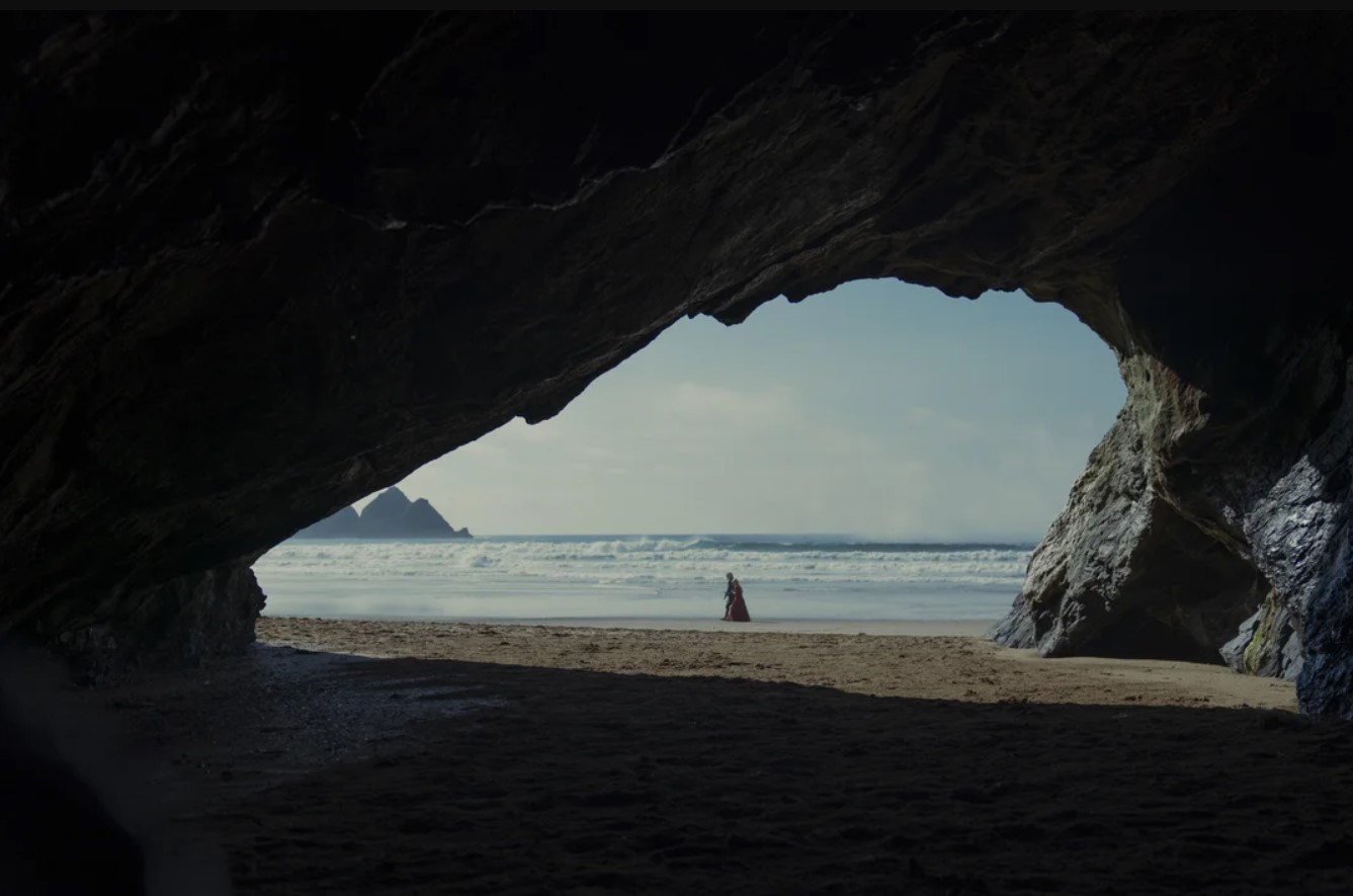 Rhaenyra and Laenor walking along the shore of Driftmark