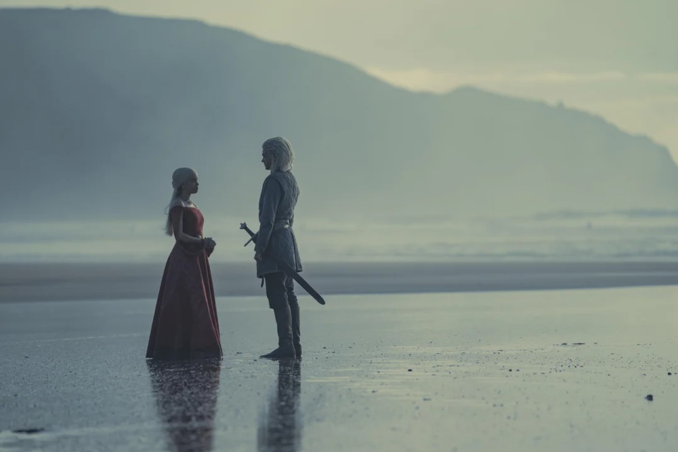 Rhaenyra and Laenor talking on the shore of Driftmark