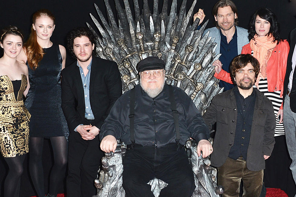 game of thrones george rr martin on iron throne 